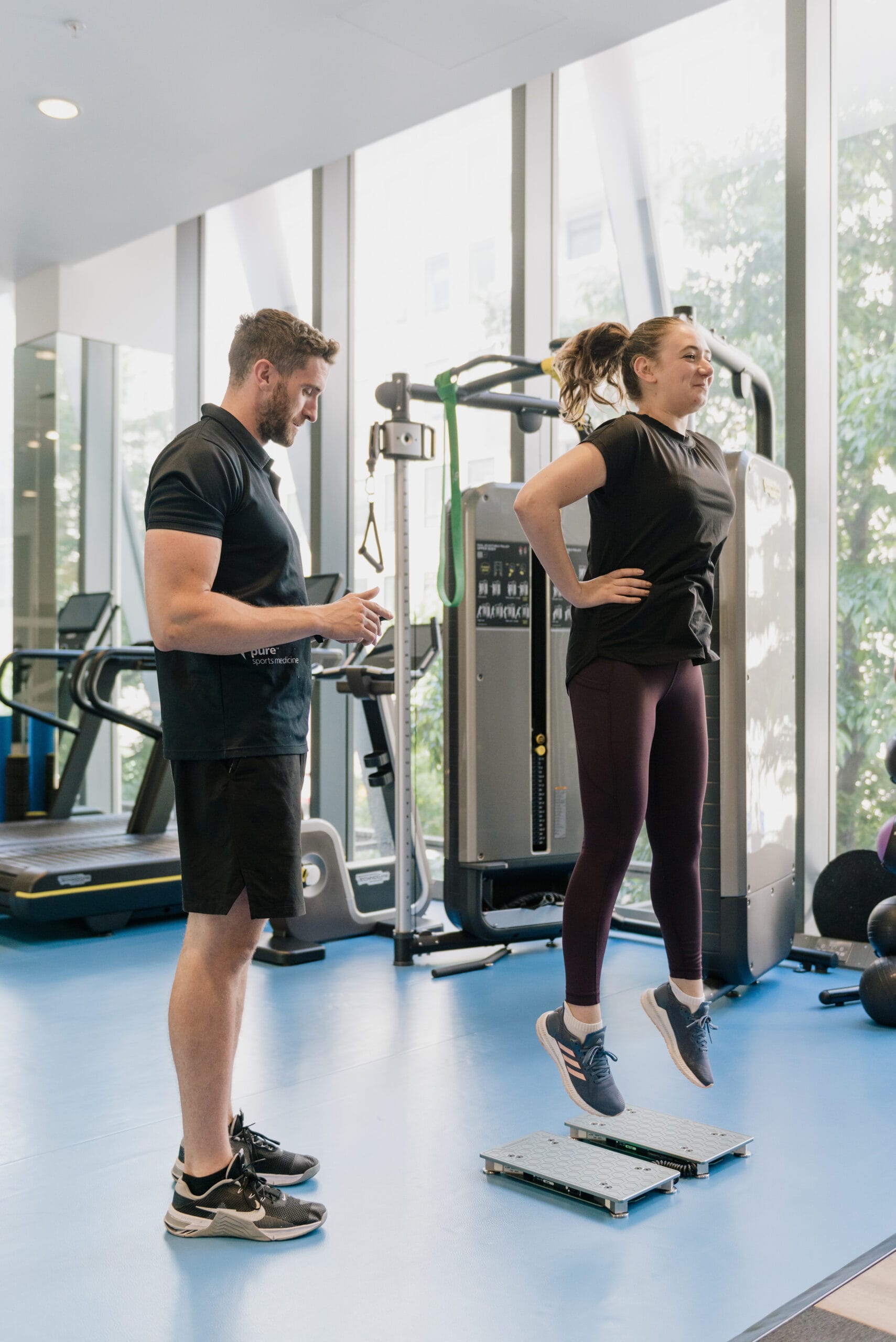 clinician watching patient jump on force decks