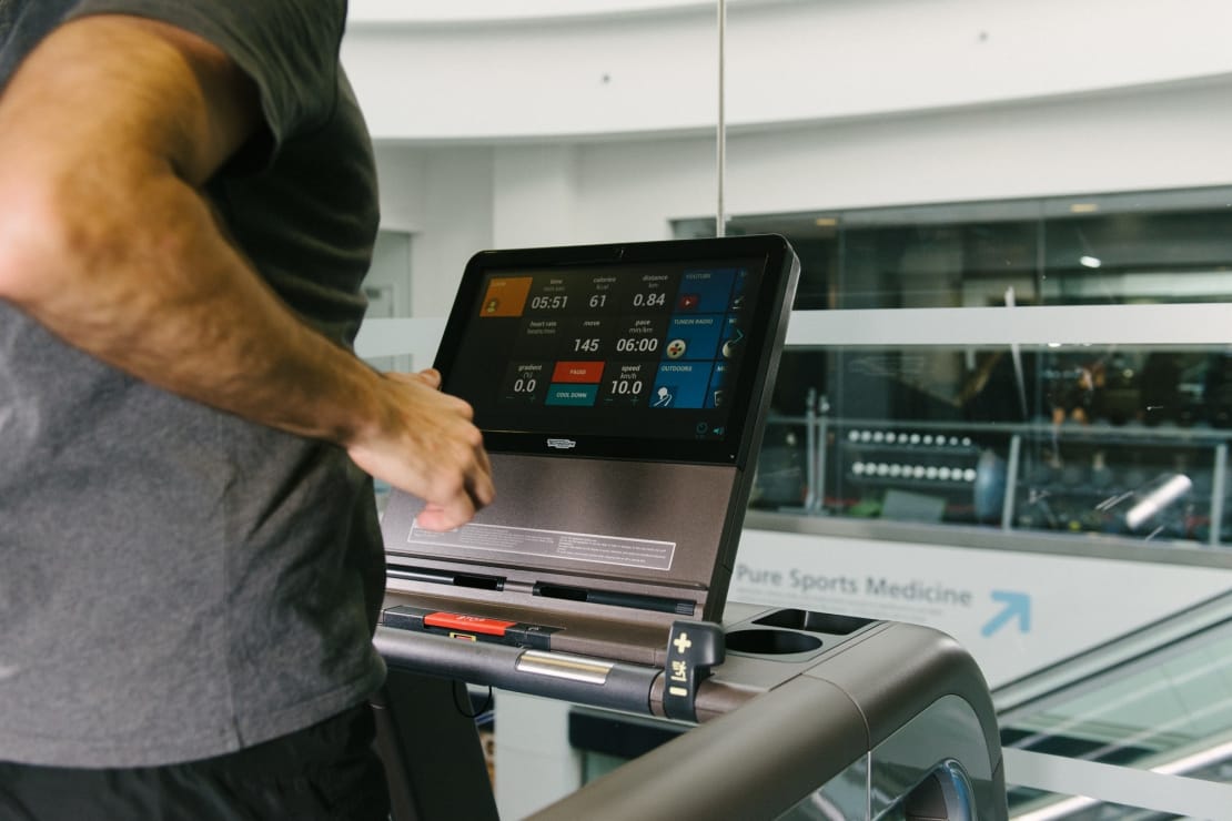 close up of someone running on a treadmill