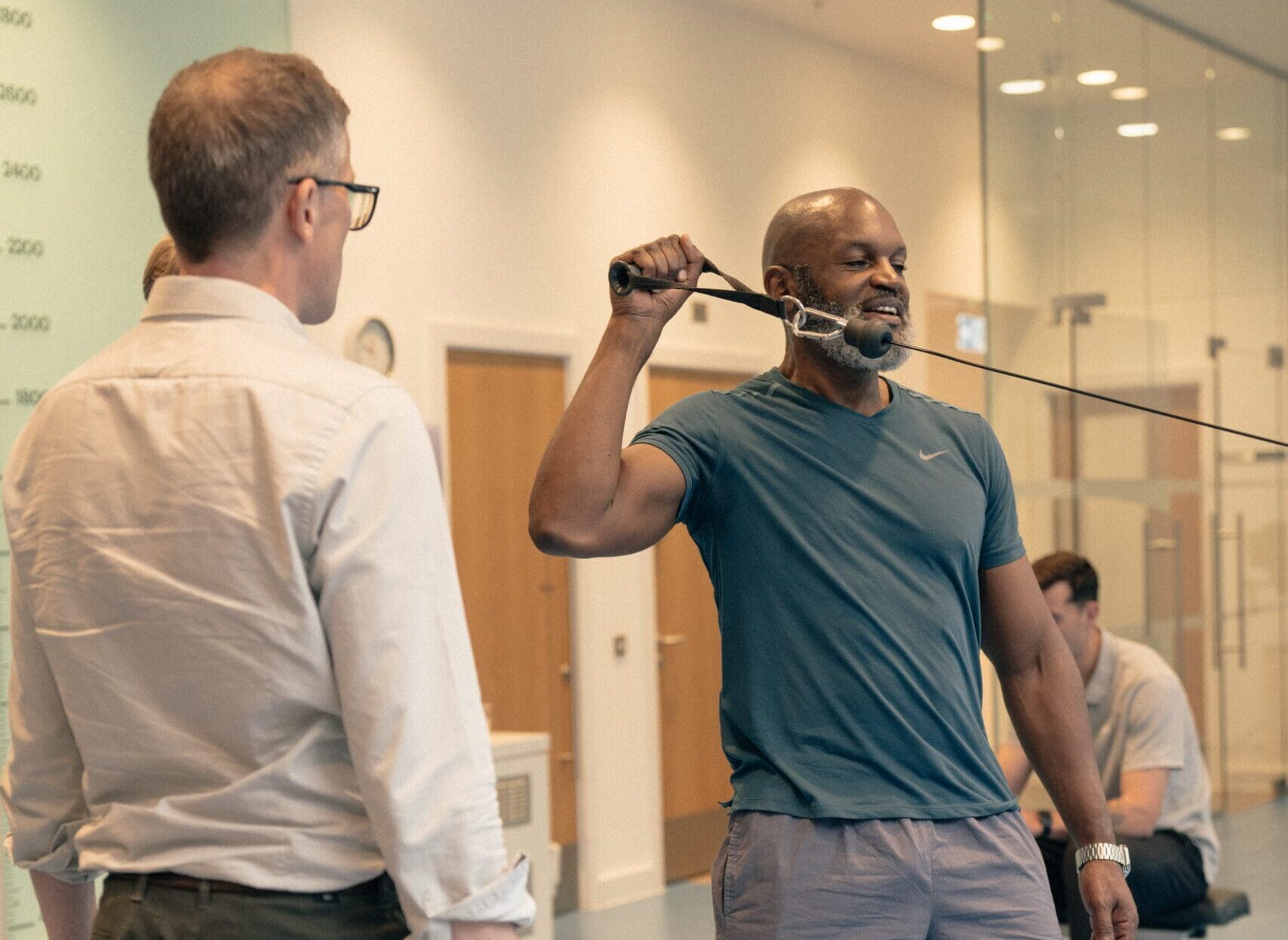 patient gym workout for recovery with clinician
