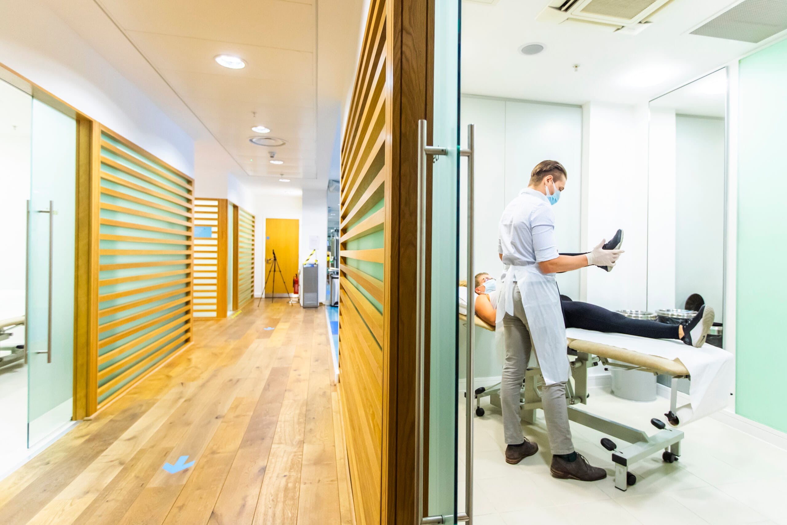 Pure Sports Medicine hallway and Clinic examination with doctor and patient