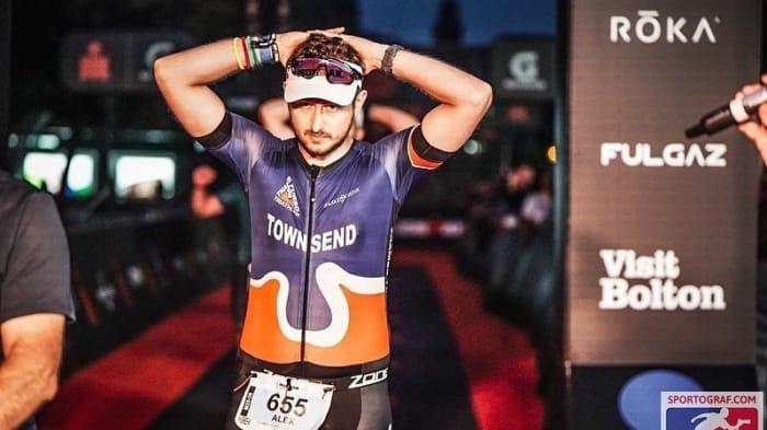 man holding his hands on his head