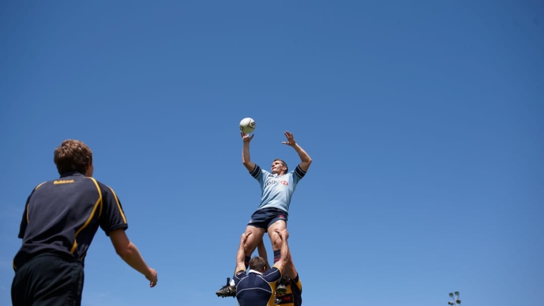 men playing rugby