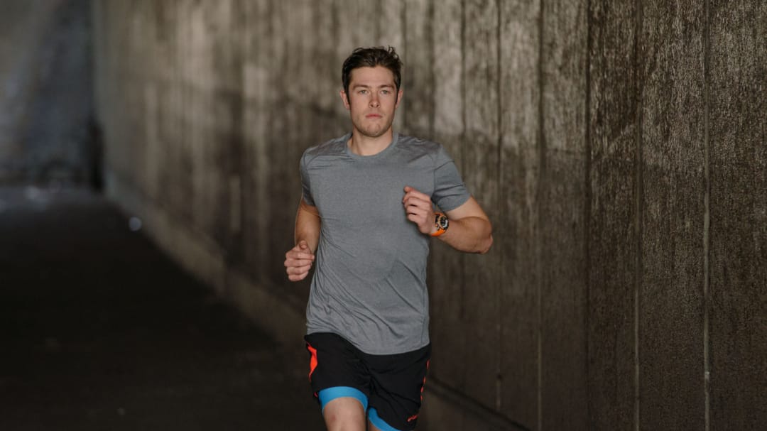 a man running in a tunnel